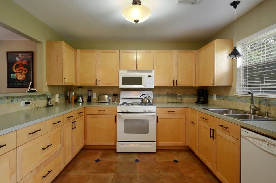 Gourmet Kitchen with Ample Counter Space, Gas Stove, Dishwasher, and More