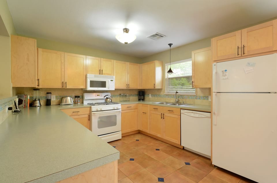 Gourmet Kitchen with Ample Counter Space, Gas Stove, Dishwasher, and More