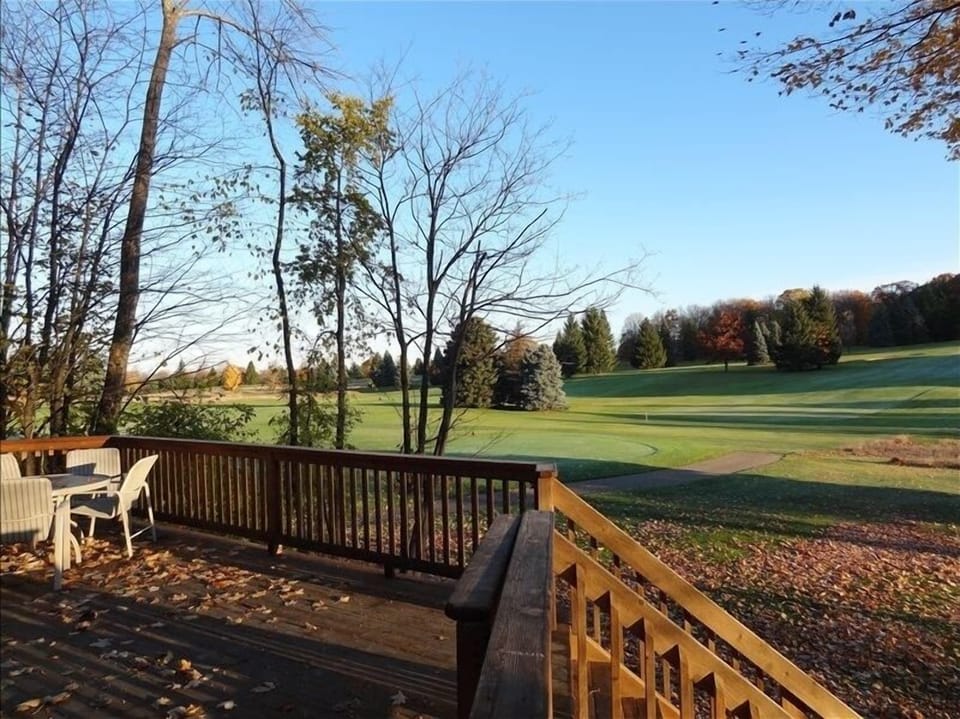 Relax on the two-tier deck and take in the views of the Summit Golf Course