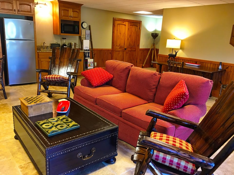 Terrace level living room with wet bar, breakfast/game table, desk & Roku TV