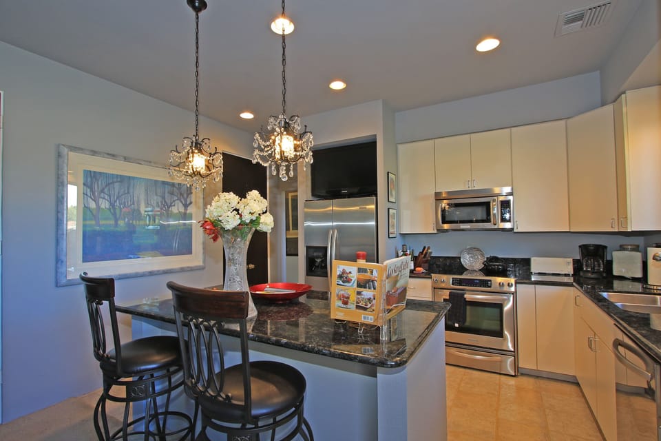 Color Plasma TV above the Refrigerator with water and ice maker