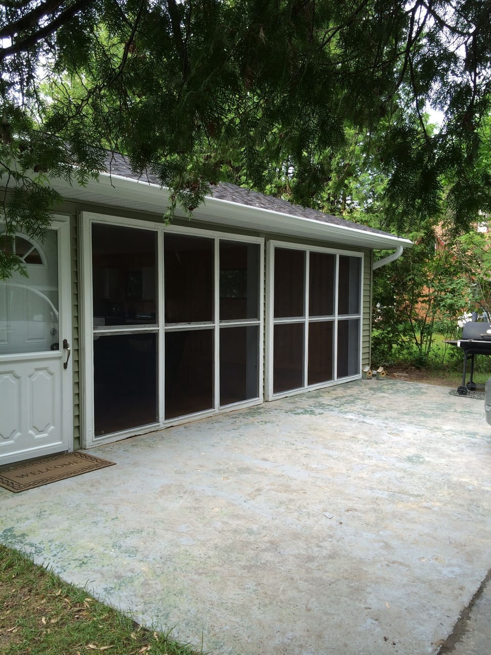 front of house - screened-in and finished garage area