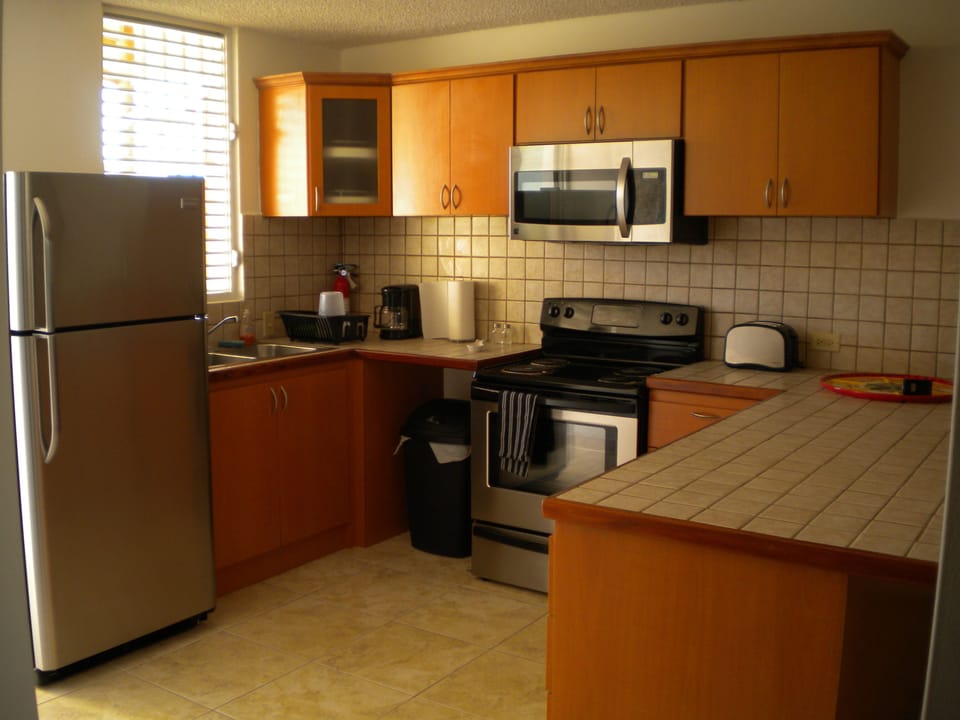 Fully equipped kitchen w/ stainless steel appliances, dishware, silverware, etc.
