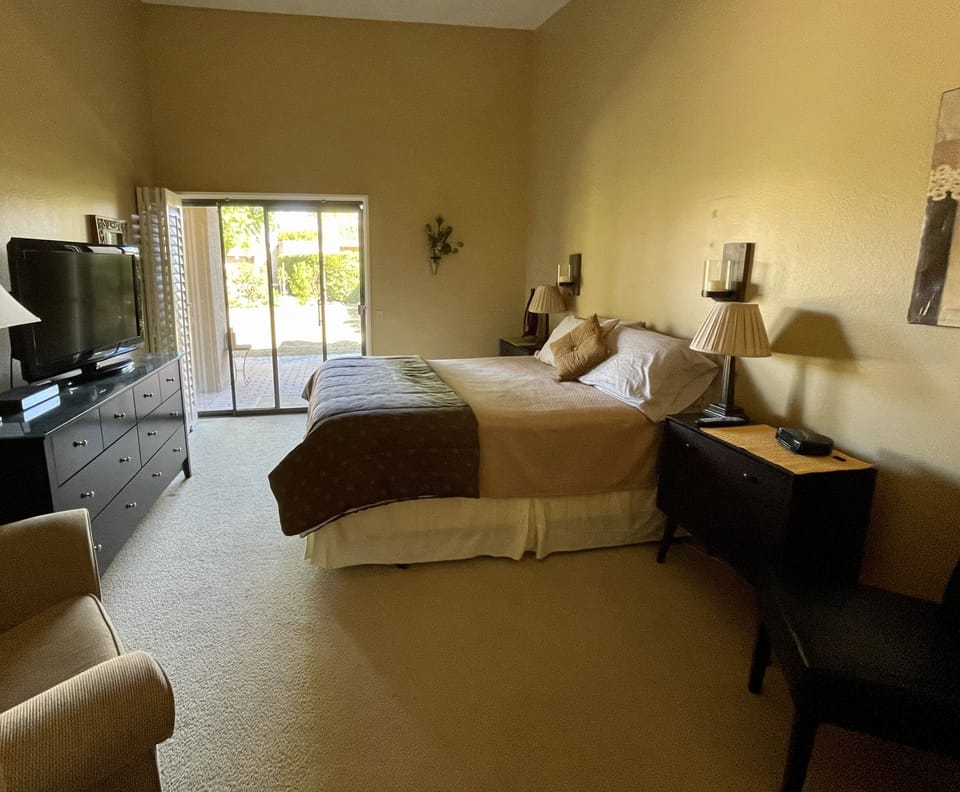 Second separate, private bedroom with flat screen TV and private bathroom