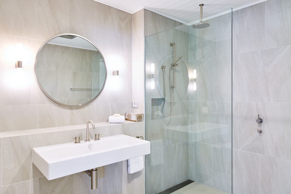 The downstairs bathroom is a designers paradise with rainfall shower.