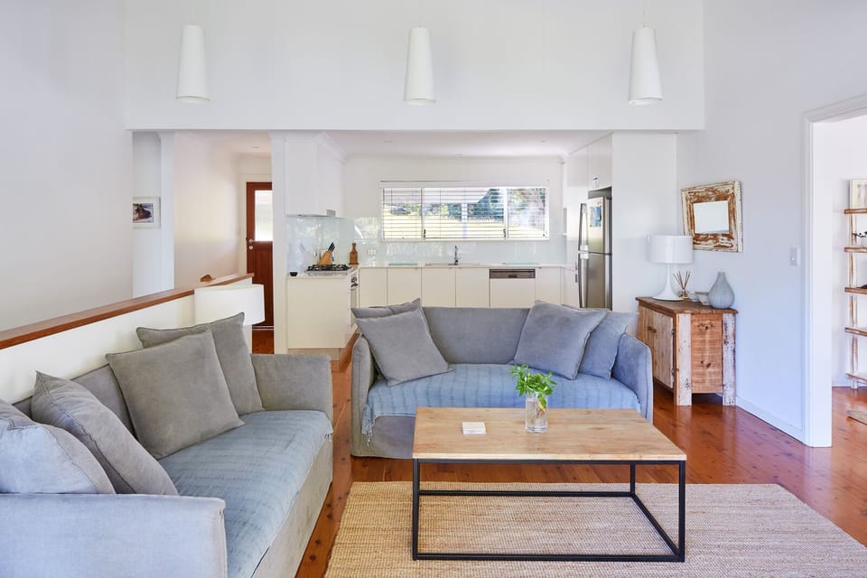 The upstairs living room has comfy sofas with stunning views of the lake.