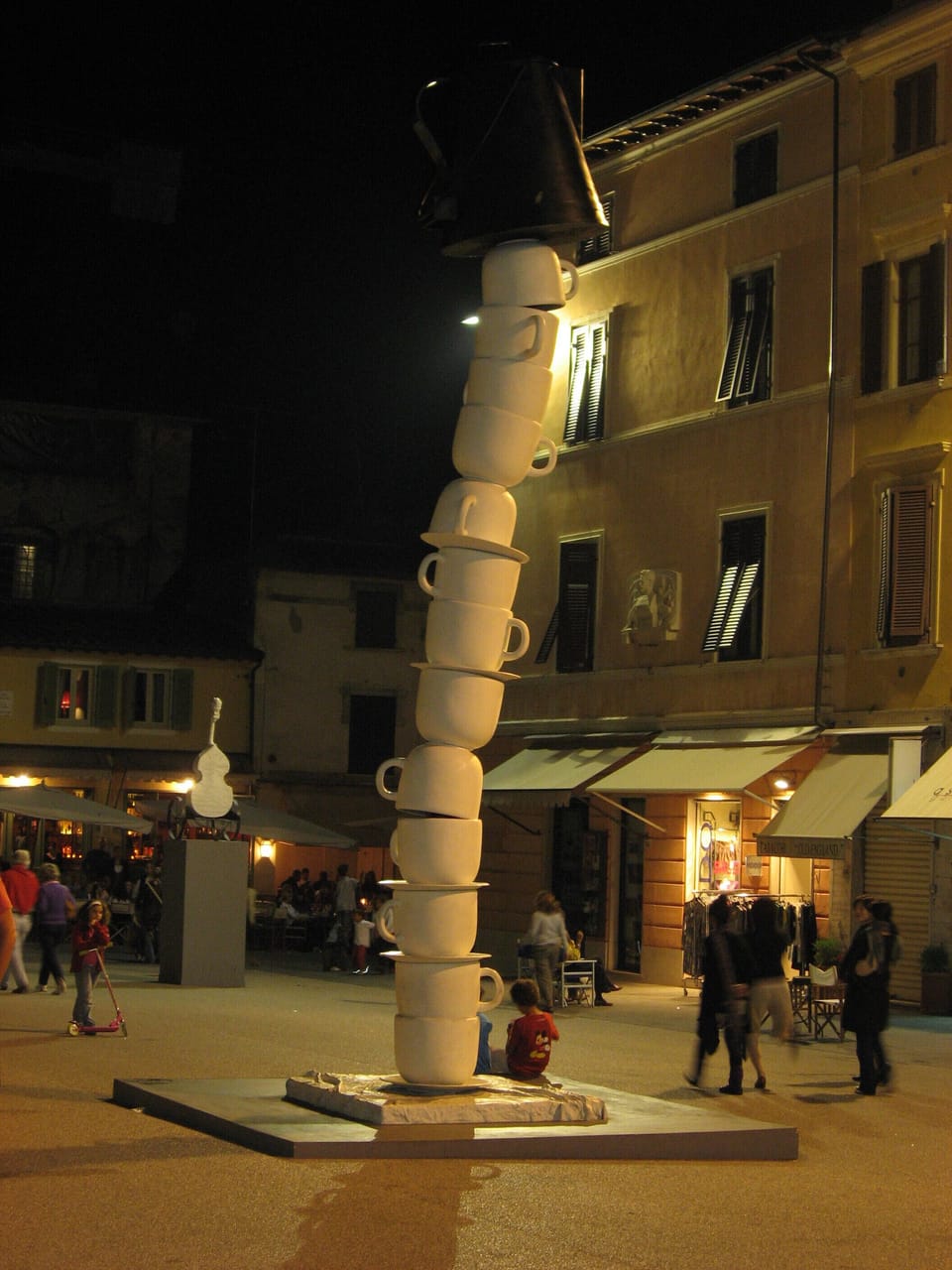 Pietrasanta Old Town - main piazza at night, shows one of many art exhibitions