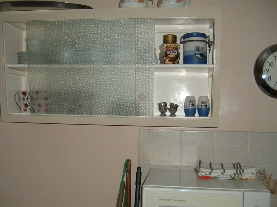 Kitchen with micro wave and equipment.