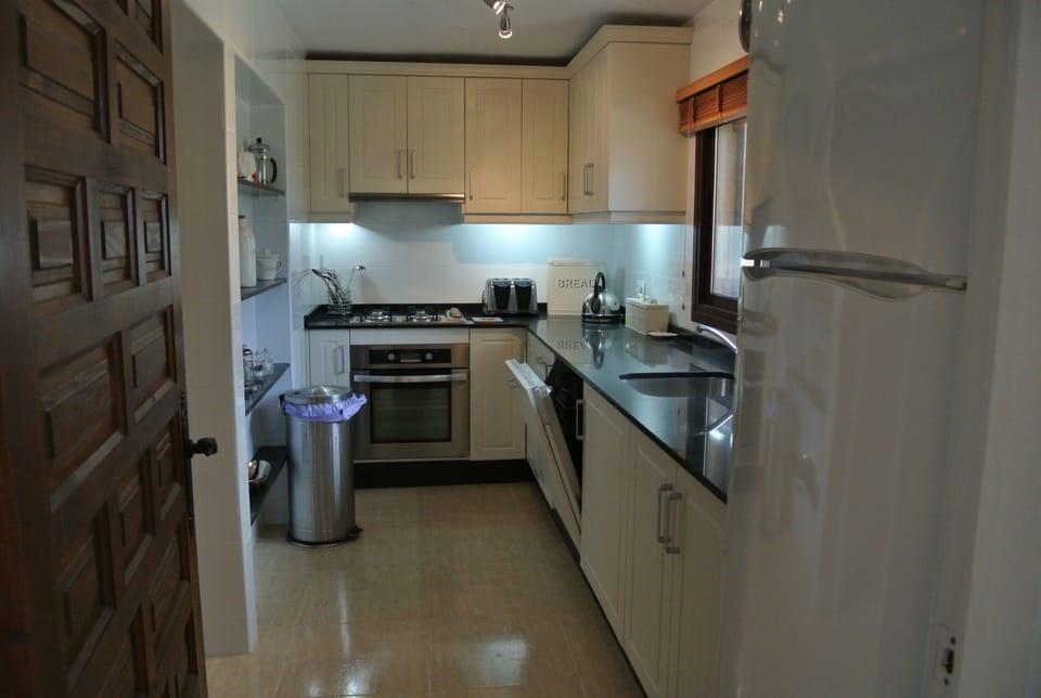 Kitchen inc d/washer- In apt leading to Utility &  laundry room & bathroom