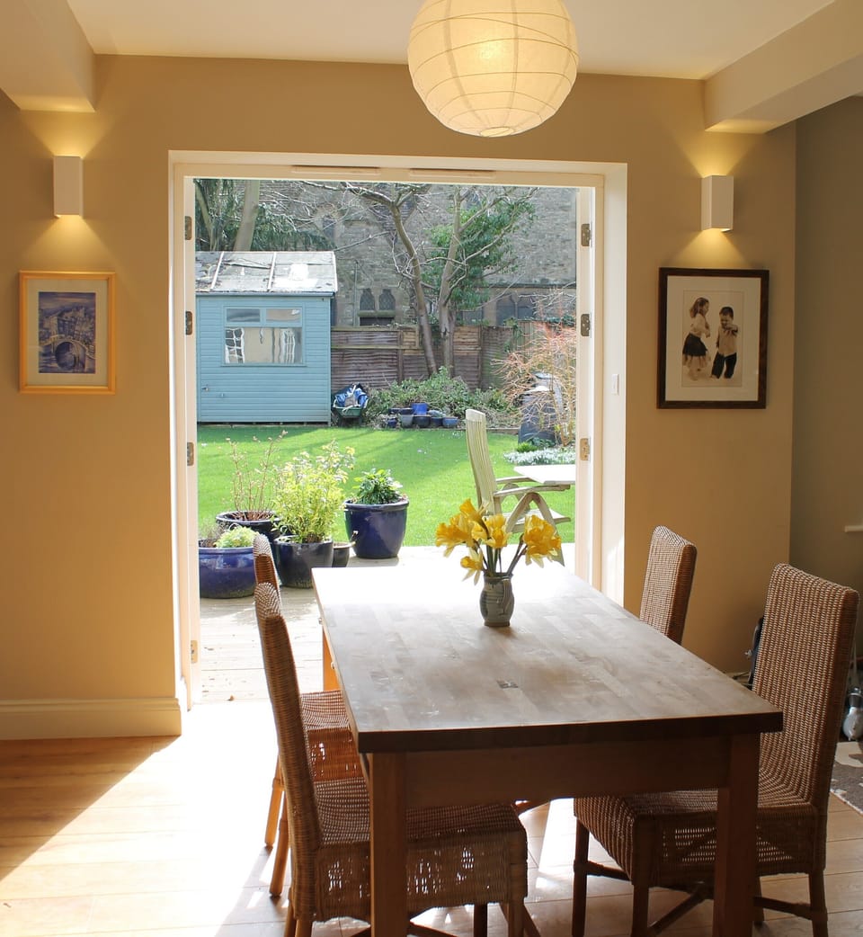 Kitchen table looking out over the decking area and garden.