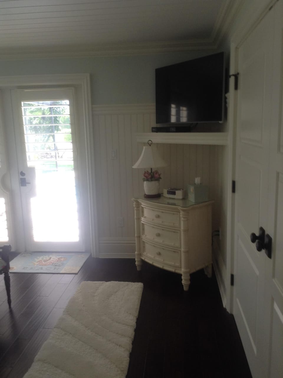 French door leading off Master wood bahama shutters throughout Flat screen tv