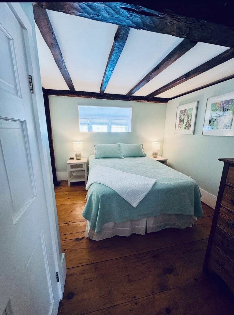 Queen bedroom note antique hand hewn beams 