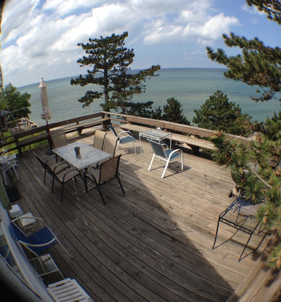 The offers a panoramic view of the beach, lake and spectacular sunsets.