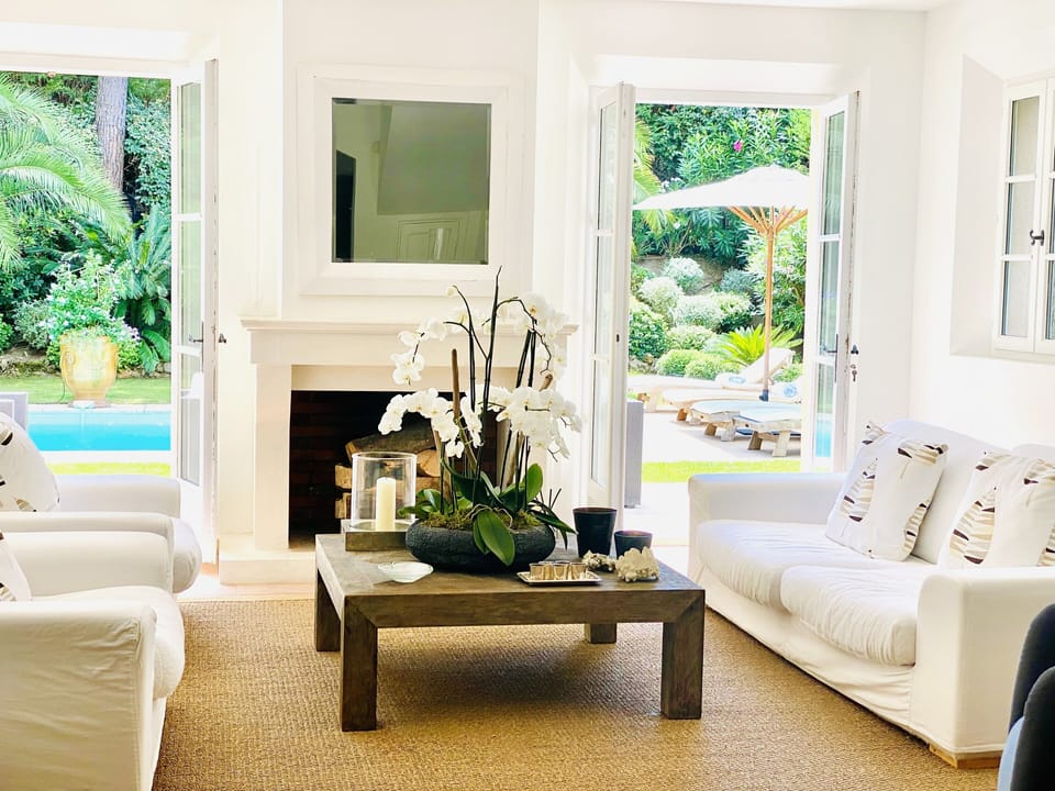 Living area overlooking the pool and garden