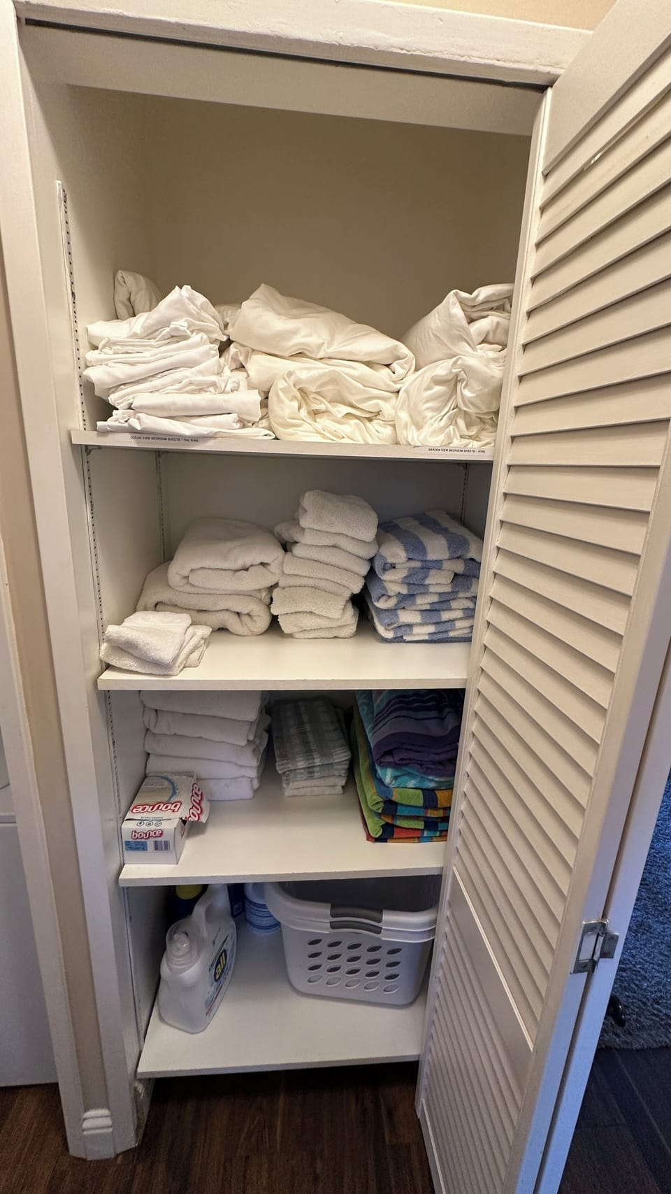 Full closet with towels for bathing, beach towels, and additional bed sheets