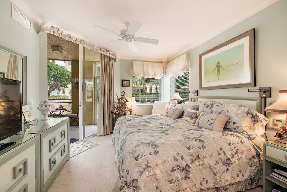 Bedroom with new split king adjustable bed,flat screen TV, massage lounge chair.