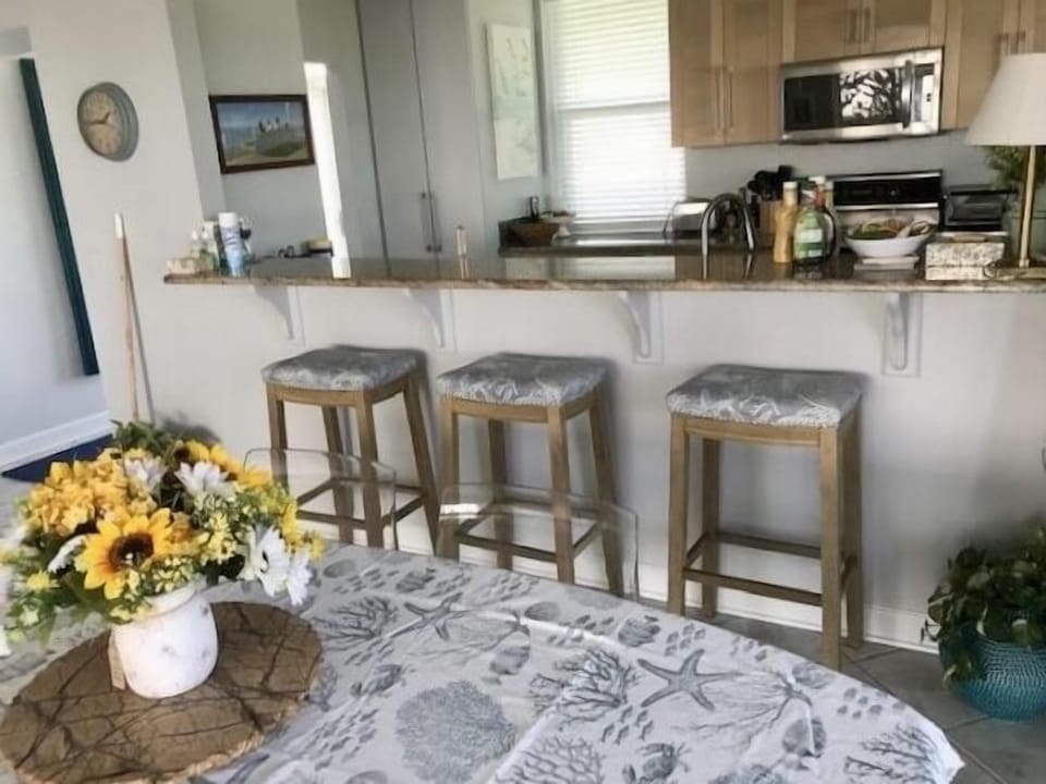 Bar with large passthrough to kitchen. 