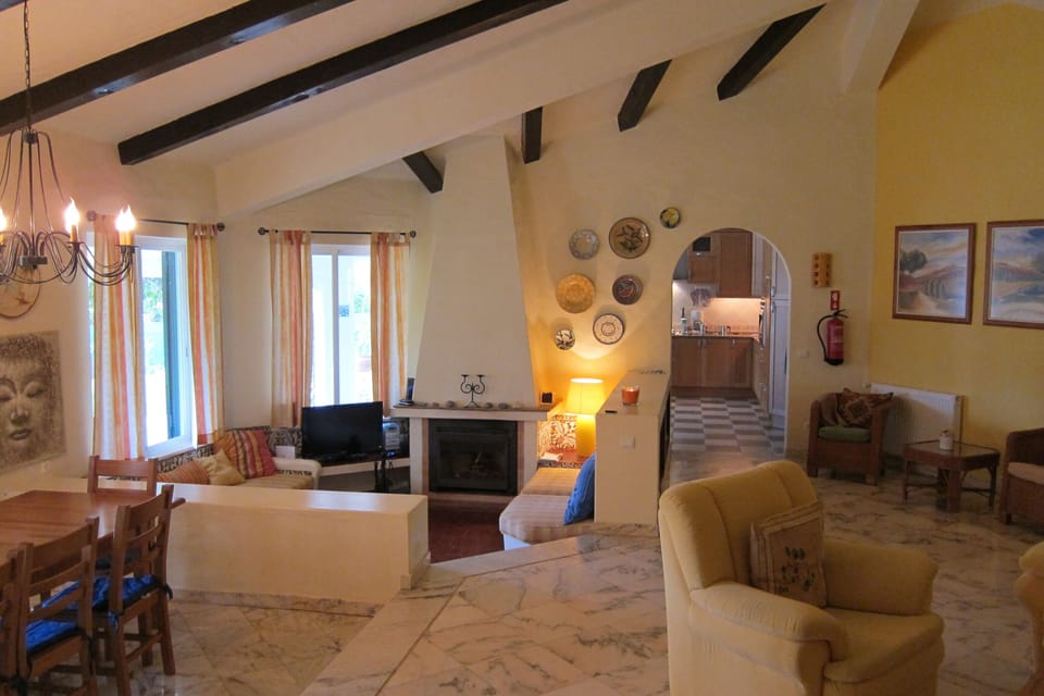 Living room - on left lower cozy corner with fire place and open door to kitchen