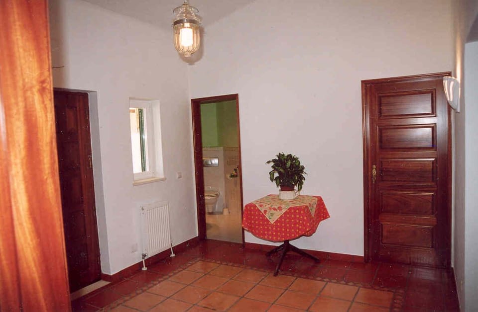 Entrance Hall - main door in right, guest toilet and on right, door to Twin Room