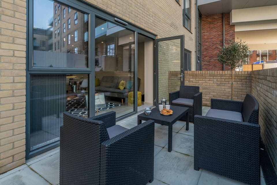 Comfy seating on a lovely terrace in a private garden.