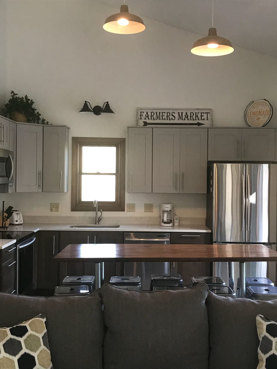 New kitchen with stainless steel appliances and quartz countertops