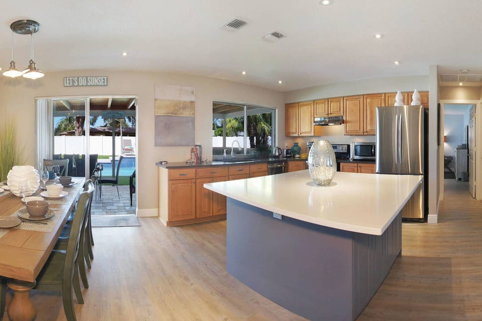 View out to lanai and pool, looking right to kitchen