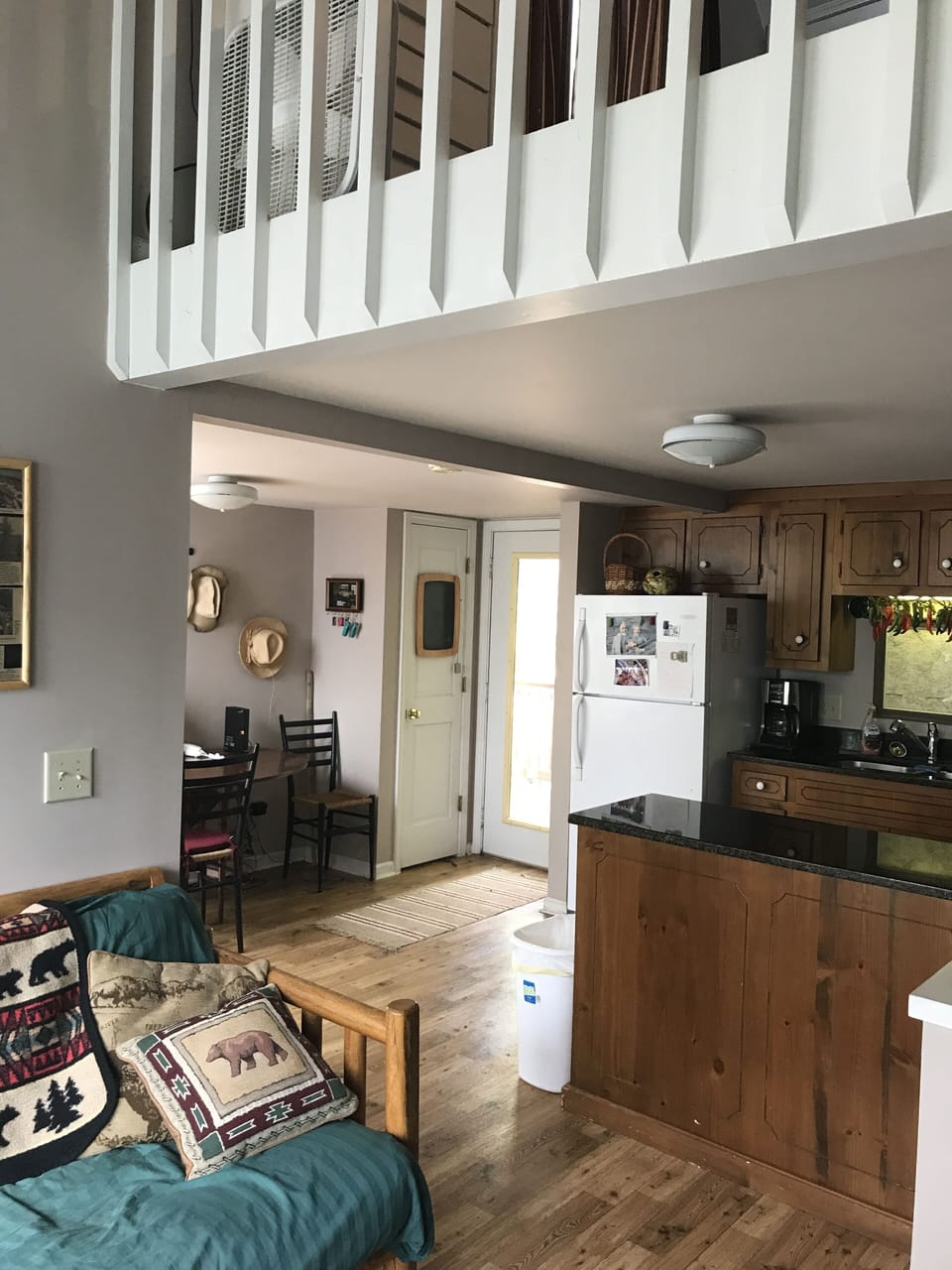 living room view to front door ... kitchen to the right of the island