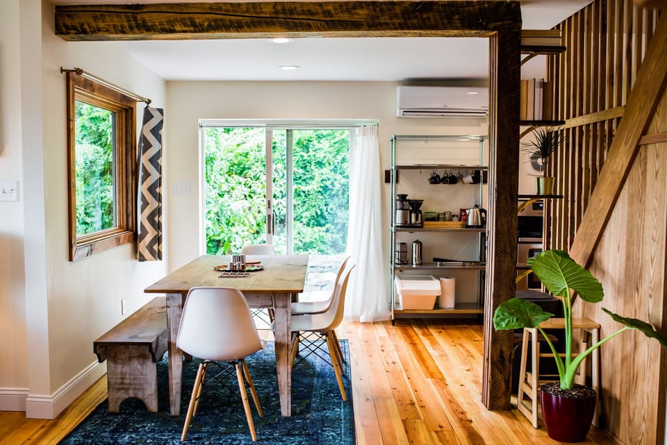 Farm table leading out to BBQ patio