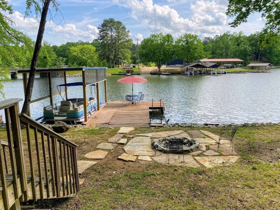 New boathouse and fire pit! Boat launch just across the slew.