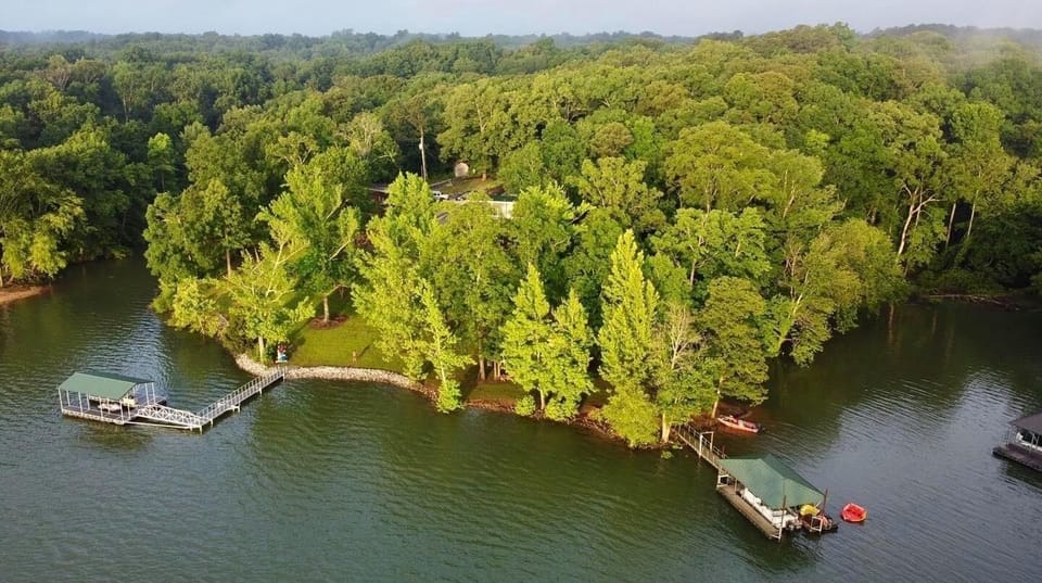 An aerial view of our point property with this house & dock on the left