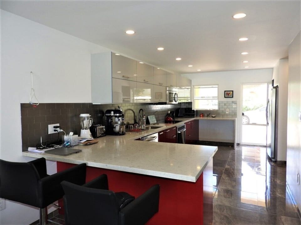Indoor-Outdoor Flow: Large sliding glass doors offer a glimpse of the outdoor seating area and provide plenty of natural
