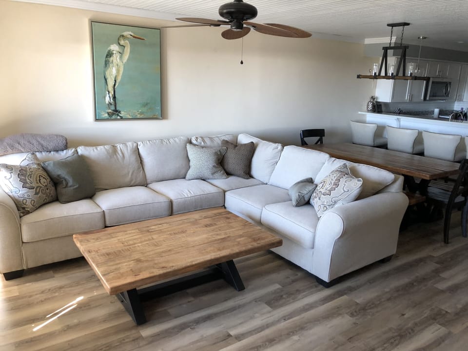 2nd floor - large wrap couch, dining seats 10, bar seats 4, loaded kitchen.