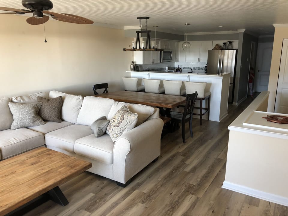 2nd floor - large wrap couch, dining seats 10, bar seats 4, loaded kitchen.