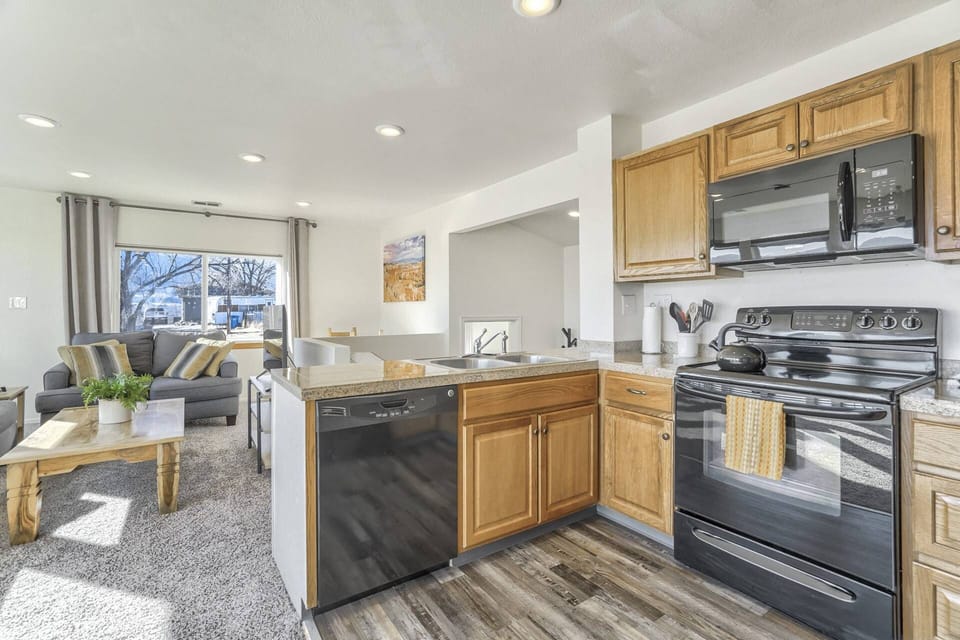 The Kitchen offers an Electric Range, Dishwasher, Microwave and Refrigerator.
