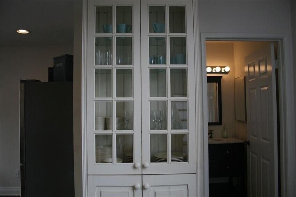 China cabinet and entry to 2nd floor bathroom.