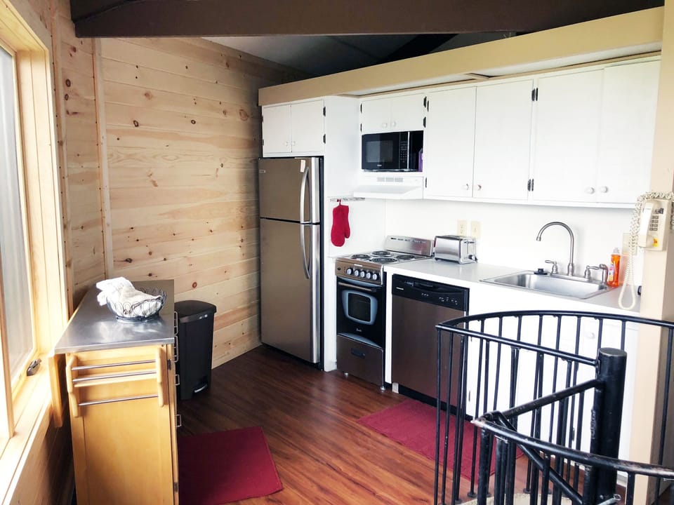 Fully stocked kitchen with stainless appliances 