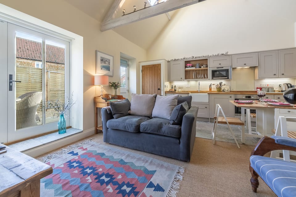 Ground floor: Open-plan living space with doors to courtyard garden