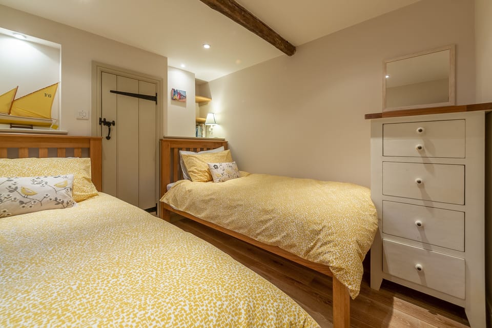 First floor: Bedroom three has full-size single twin beds