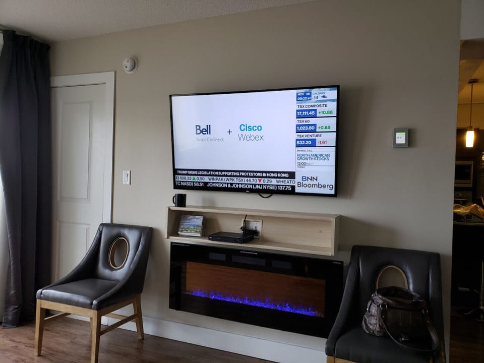 Large flat screen TV over fireplace