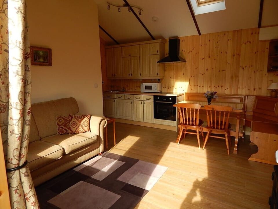 Cabin lounge, dining area & kitchenette.