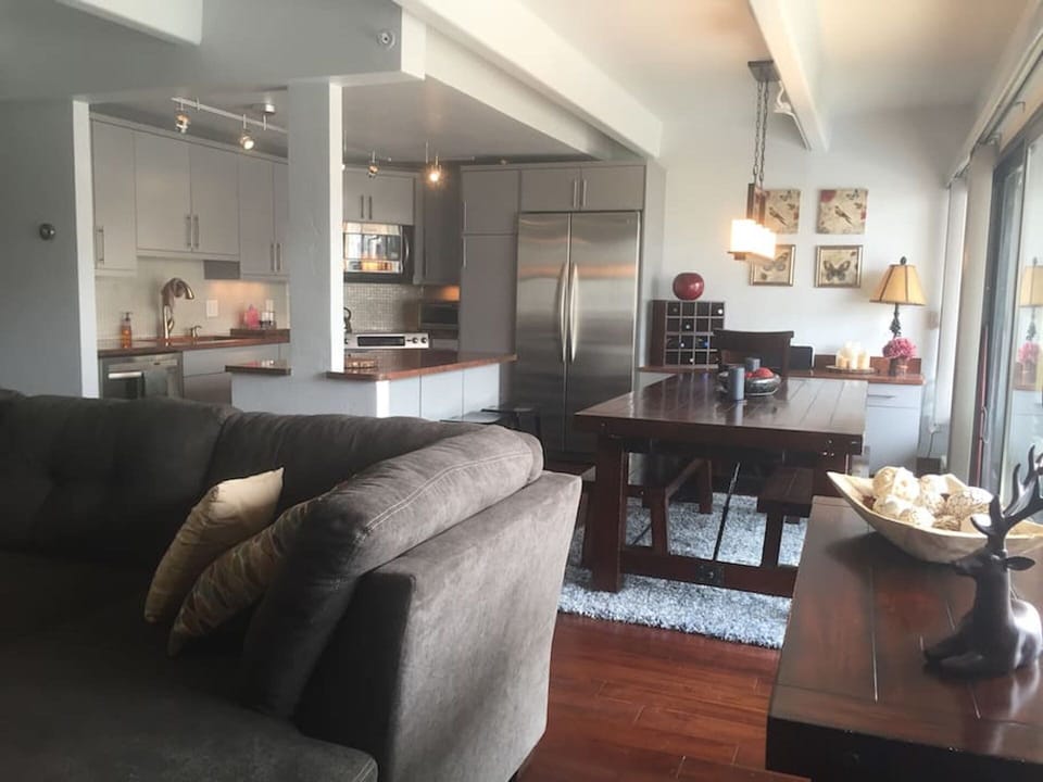 Open living space of kitchen, dinning, living rooms