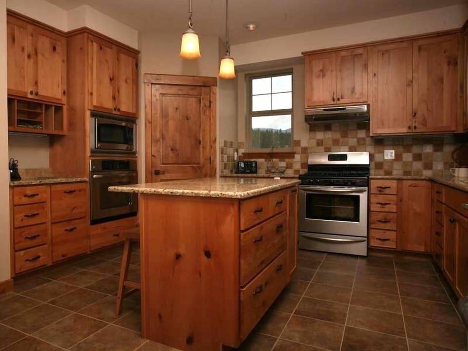 2 ovens, Gas Range, GE Profile Refrigerator, Microwave, Alder and Granite