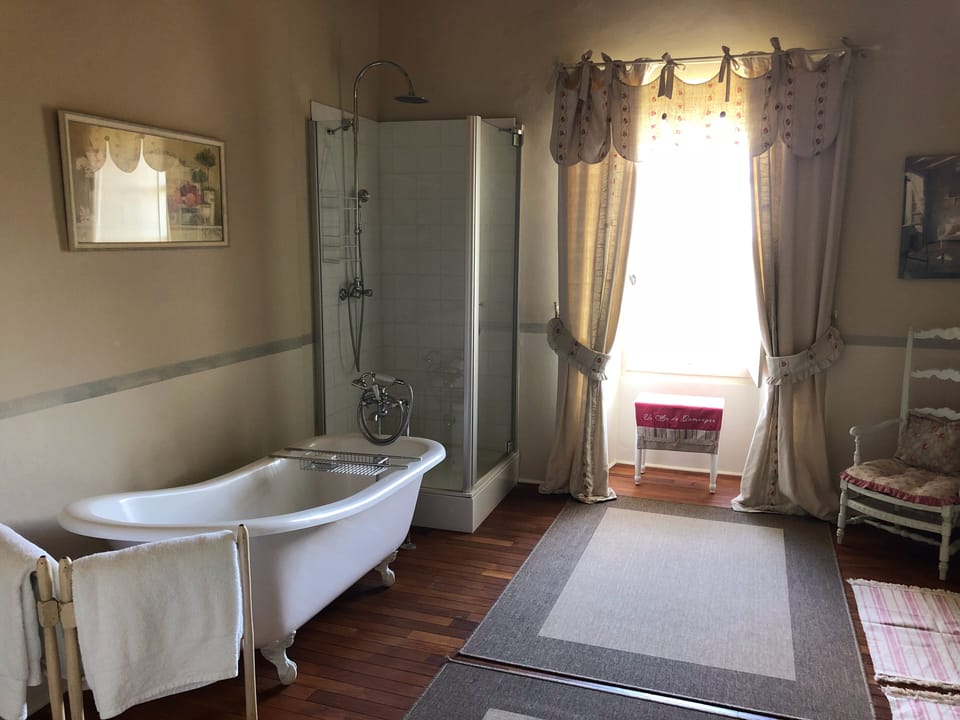 Master bathroom with  claw foot tub and stand-alone shower