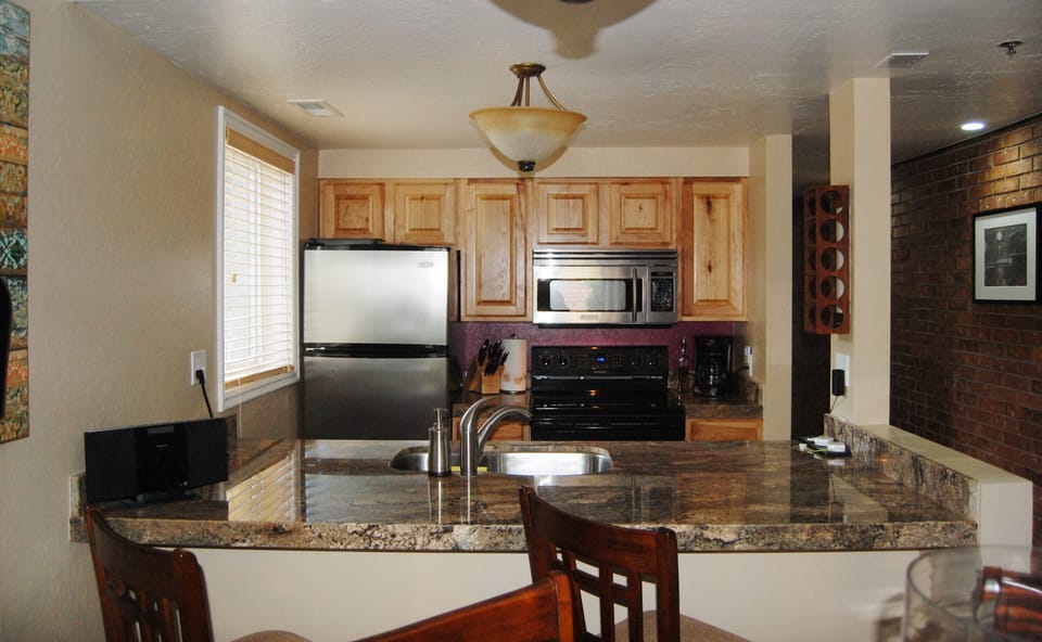 Open concept kitchen and dining. Prepare dinner from the fully stocked kitchen.