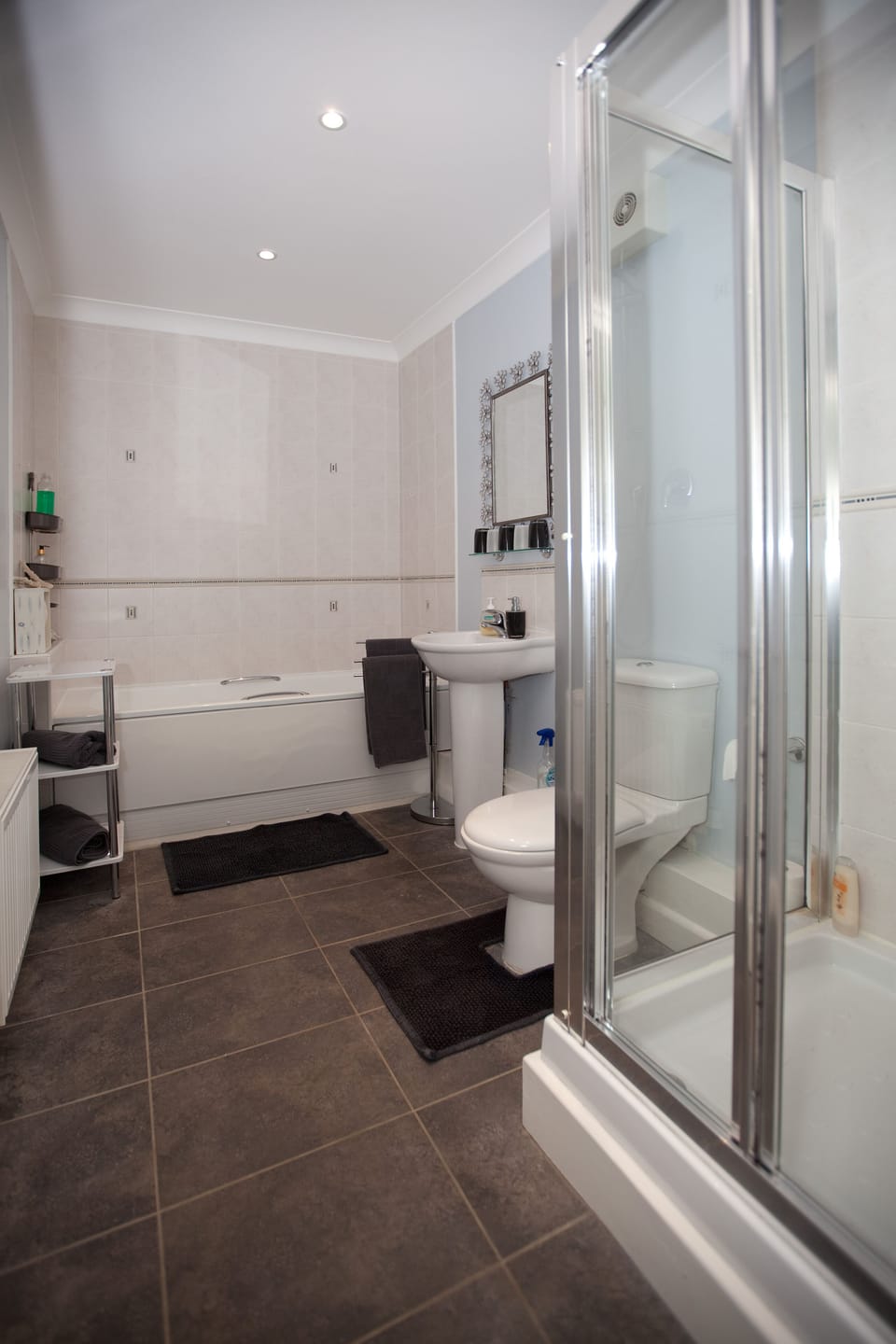 Family bathroom with bath tub and separate shower