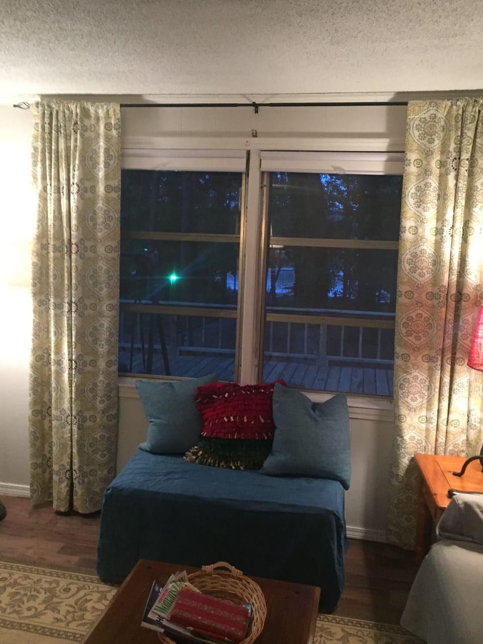 Living room window towards lake at evening. Lots of comfortable seating!