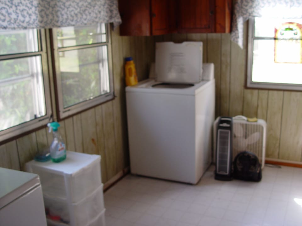 Huge Laundry room with washer/dryer, extra fan and roll away bed