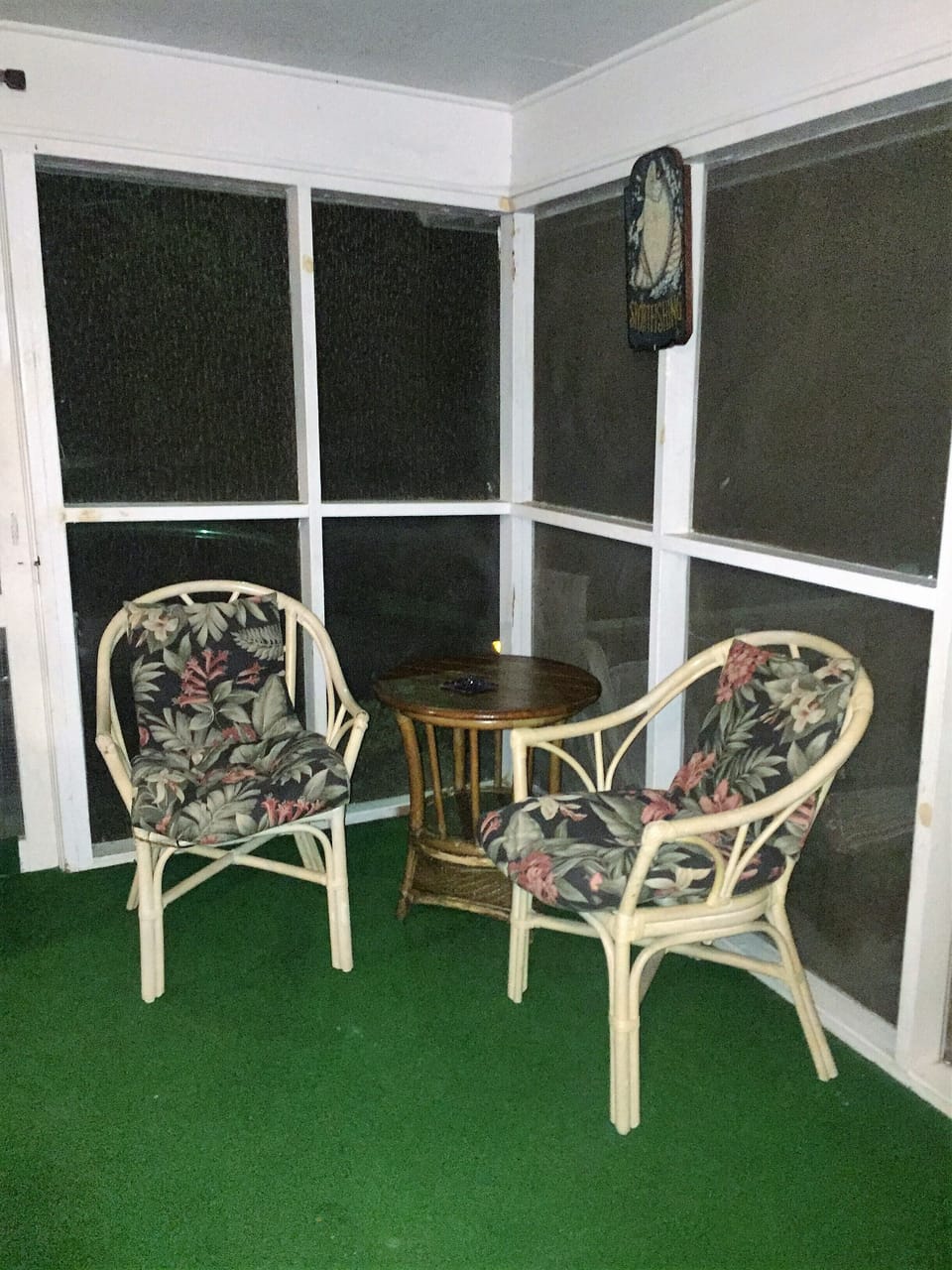 Comfortable Seating in the large screened in porch with lights and ceiling fan