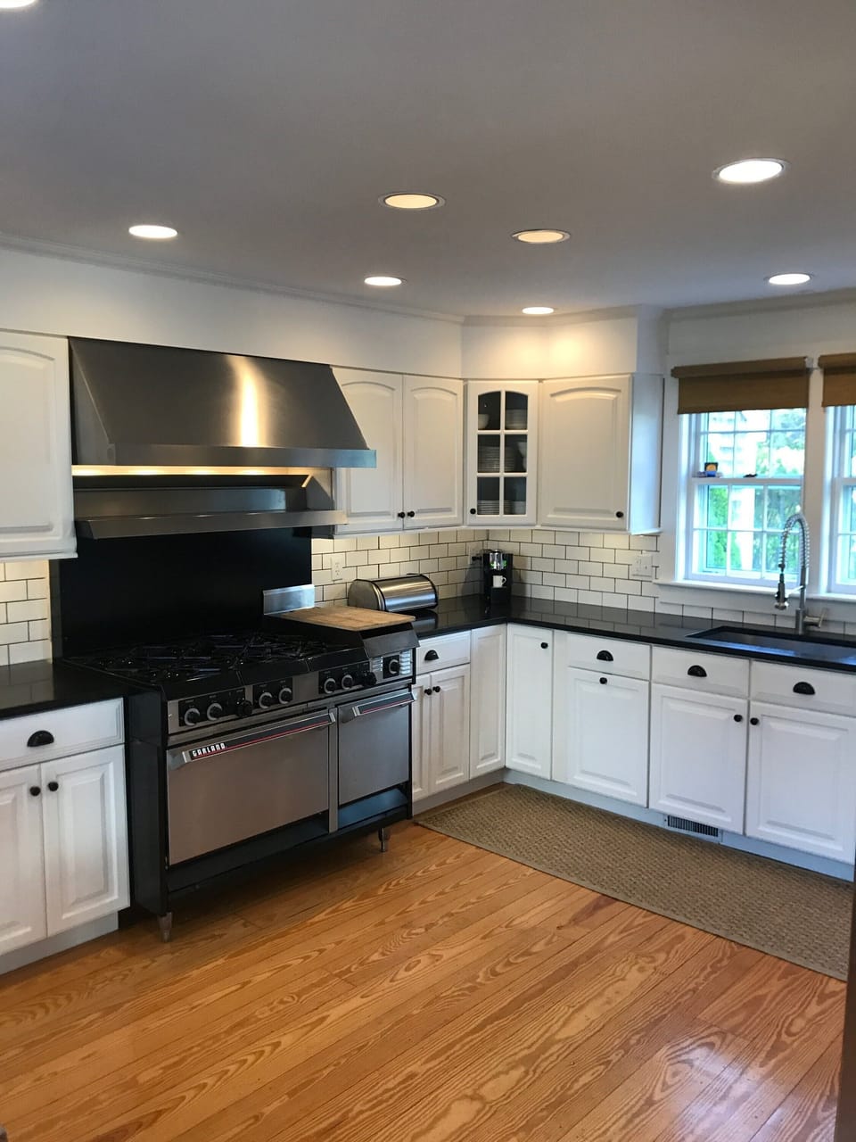 renovated kitchen with six burner stove, new refrigerator and dishwasher

