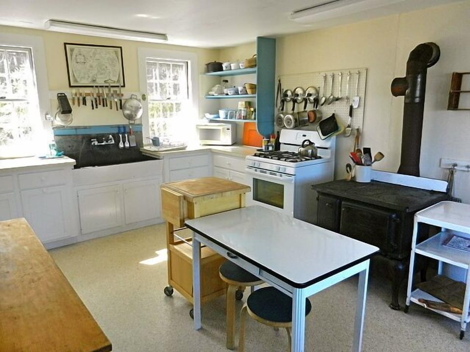One side of Eat in Kitchen -with stove, oven, sink 